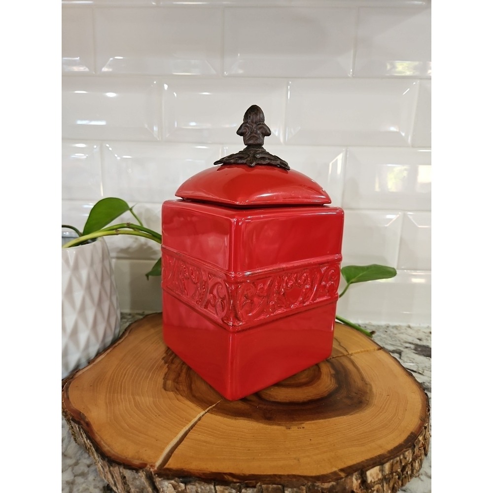 Decorative Red Canister- Ceramic Body With A Decorative Finial On The Lid